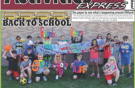 Students outside at Upchurch Elementary holding Back to School Signs