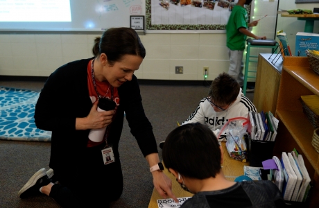 Teacher working with students