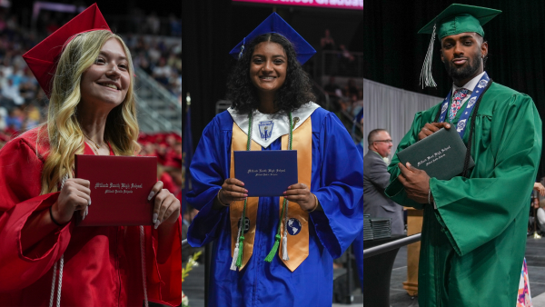 22 graduates holding diplomas