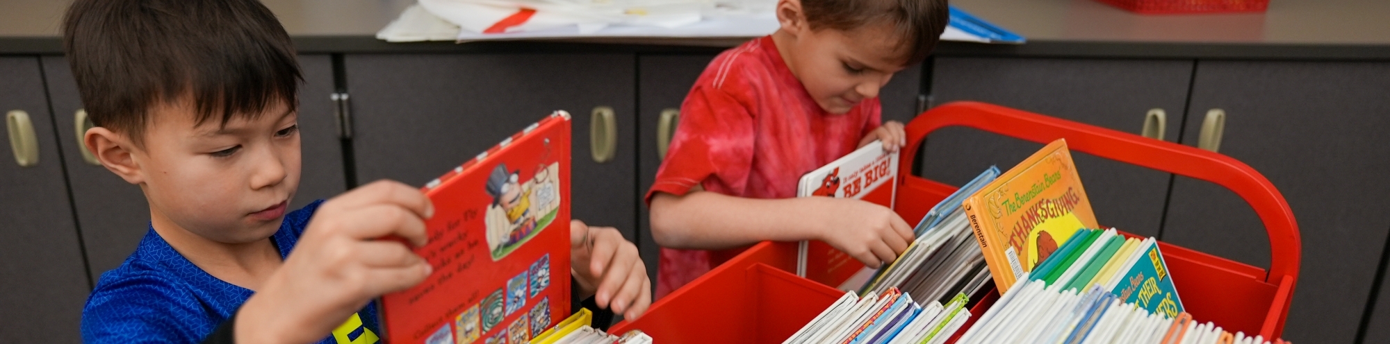 students picking out books