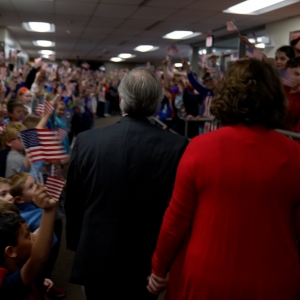 Students form a tunnel of flags 