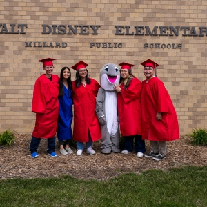Disney Grads pose with Disney Dolphin