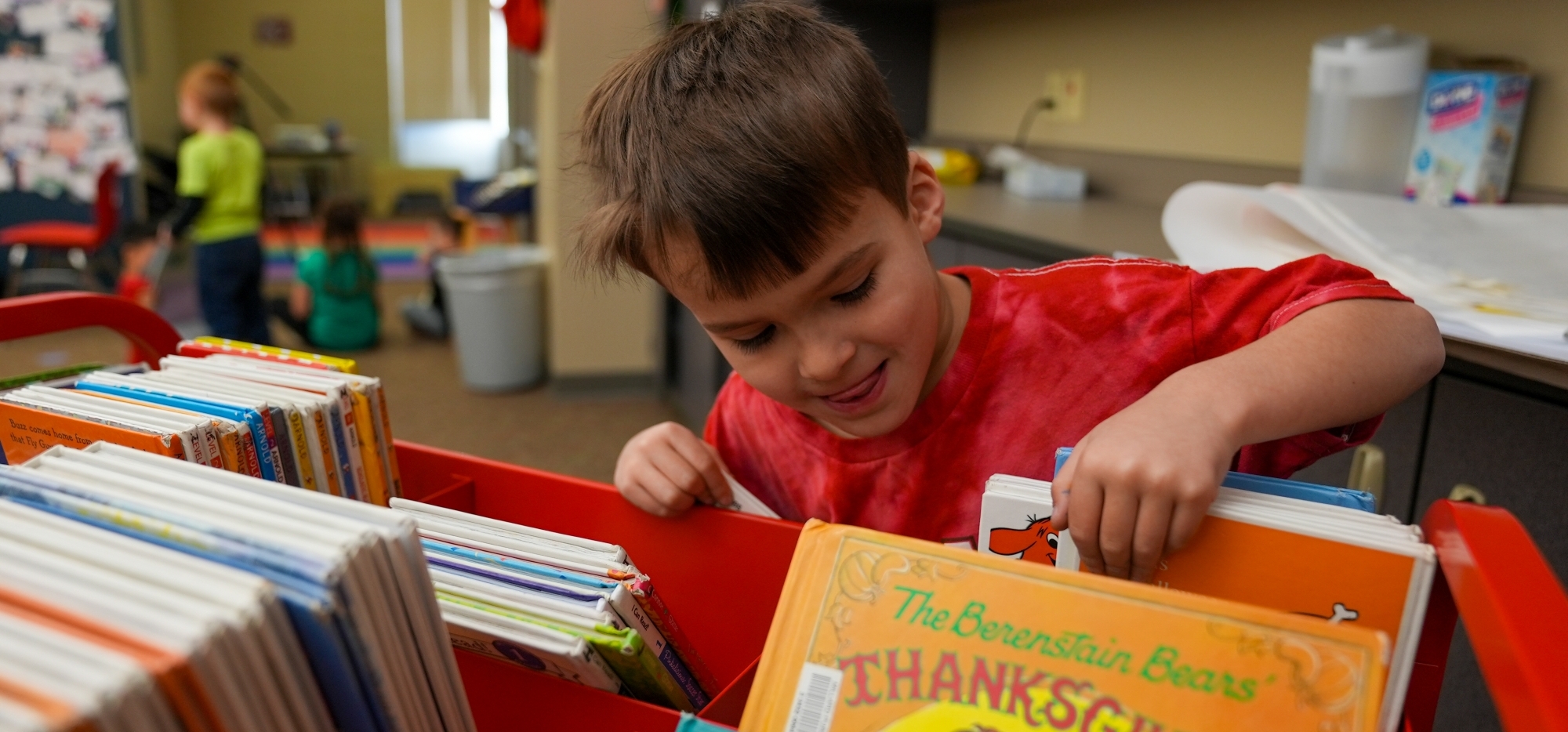 kid looking for books